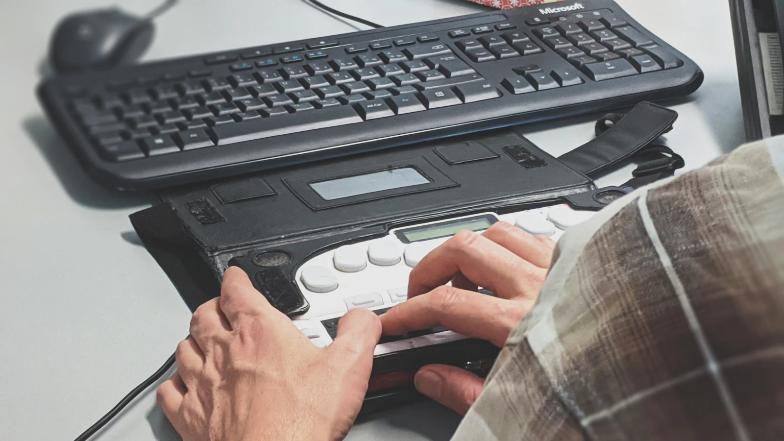 Keyboard user representing accessible web design in Leicestershire